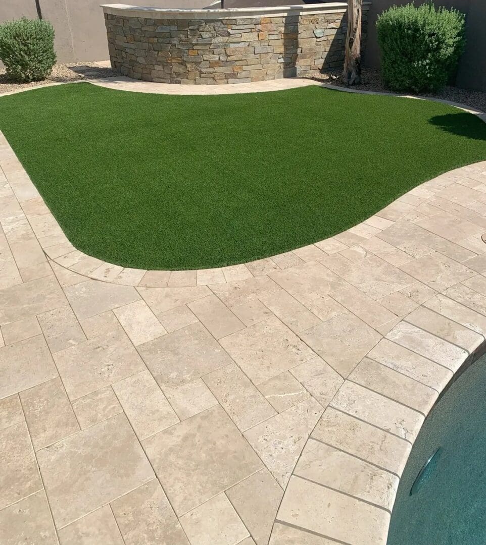 A backyard with a pool and grass